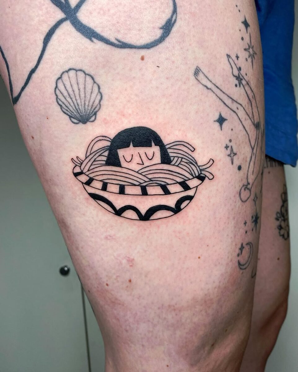 Whimsical pasta tattoo featuring a playful character