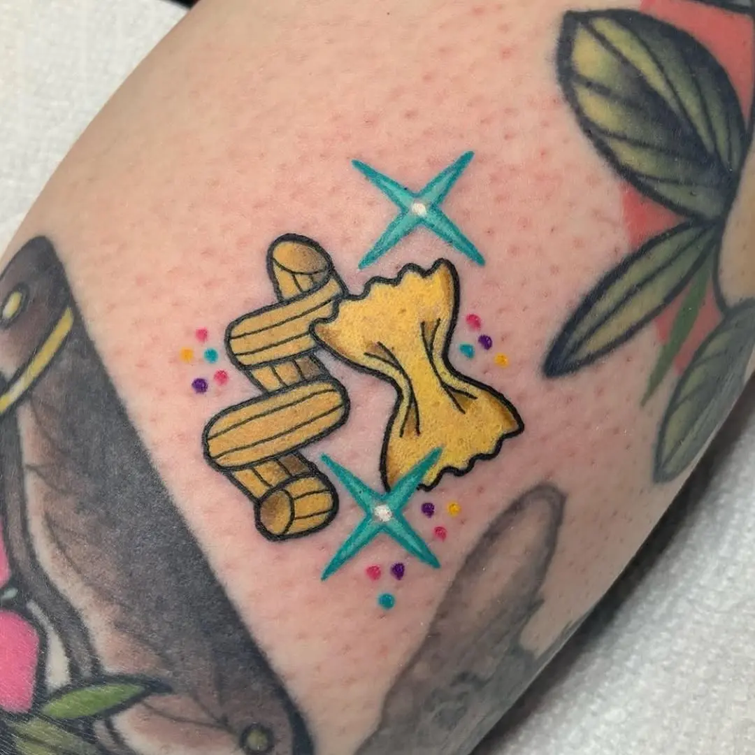 Whimsical farfalle and twirling pasta design tattoo