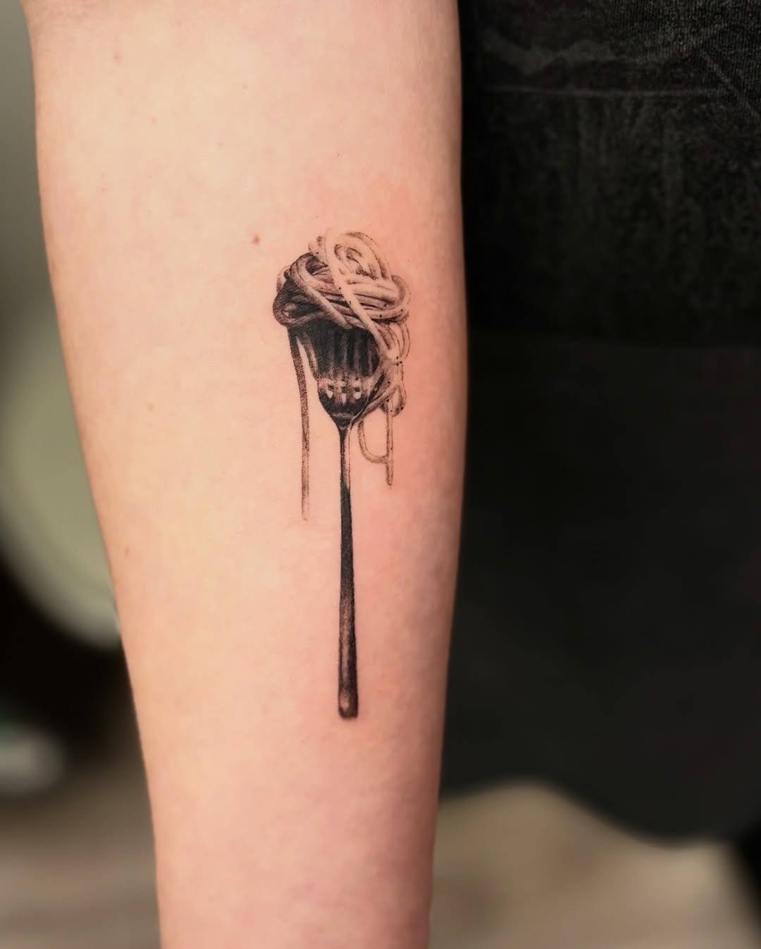 Creative fork and spaghetti tattoo design