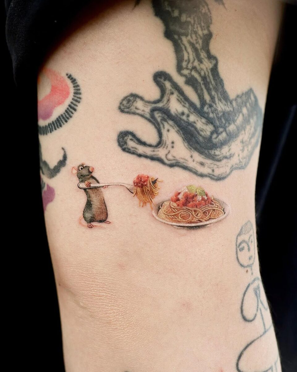 Whimsical rat tattoo with spaghetti scene