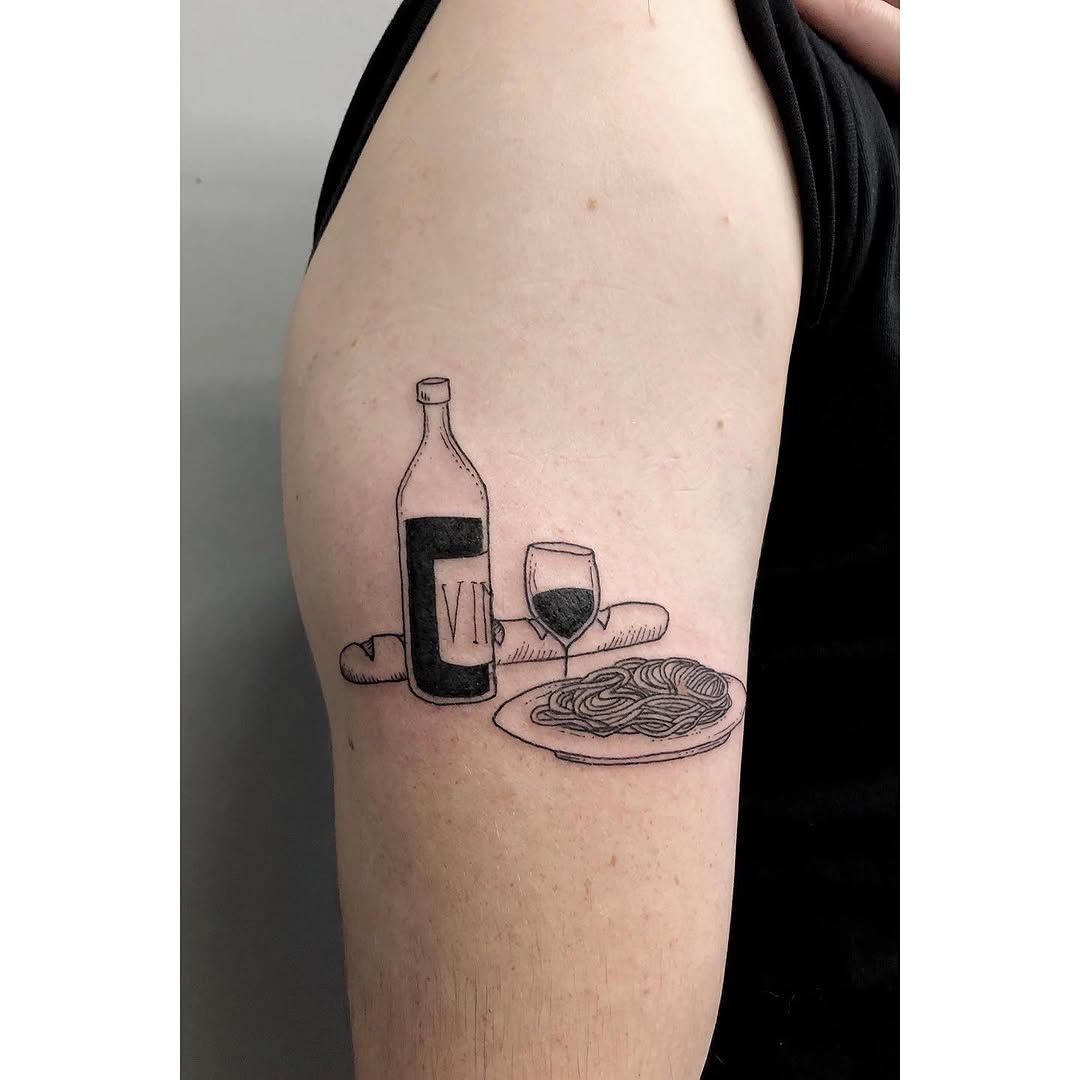 A playful dinner-themed tattoo design