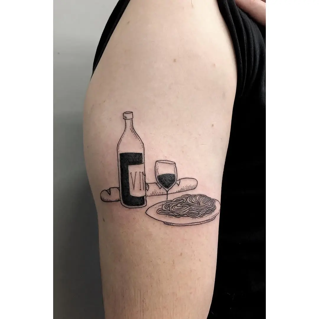 A playful dinner-themed tattoo design