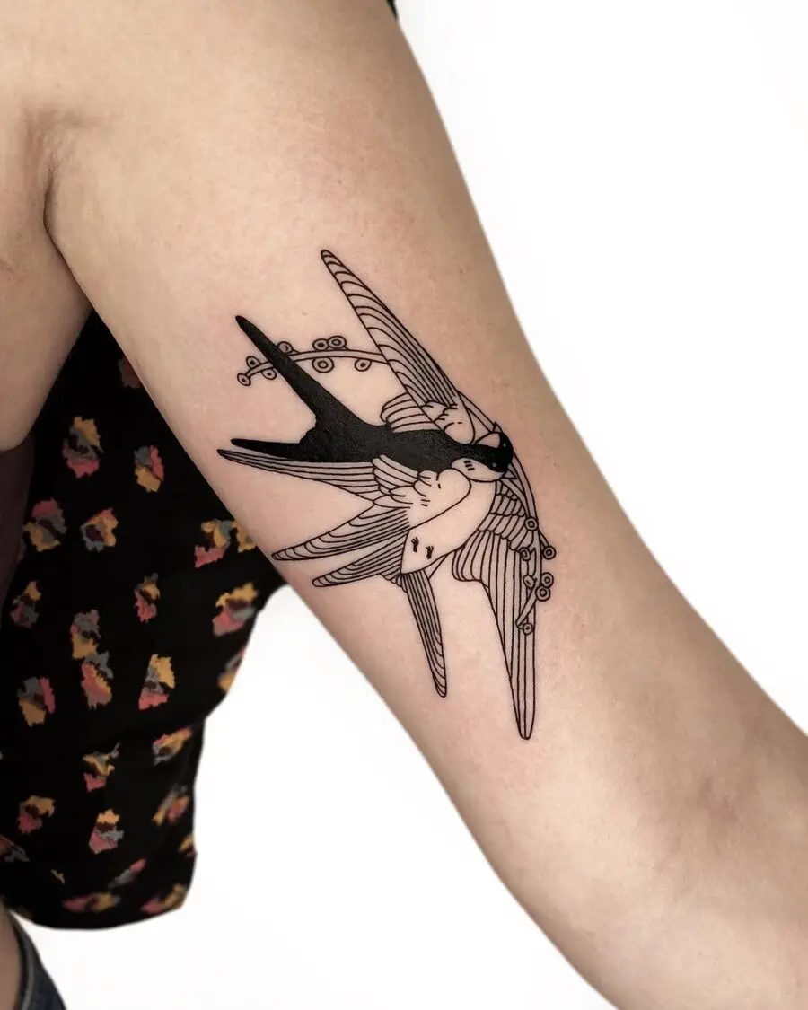 Artistic swallow tattoo representing freedom and peace