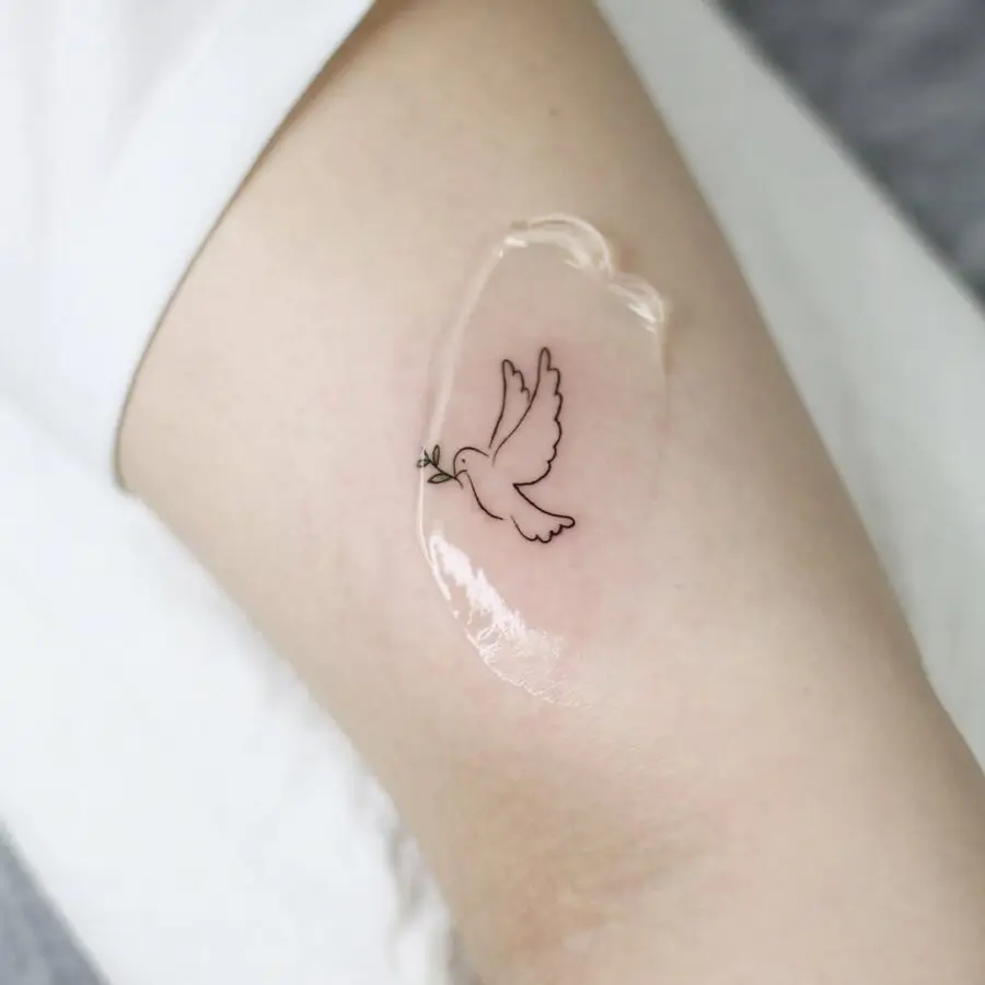 Simple dove tattoo symbolizes peace and freedom