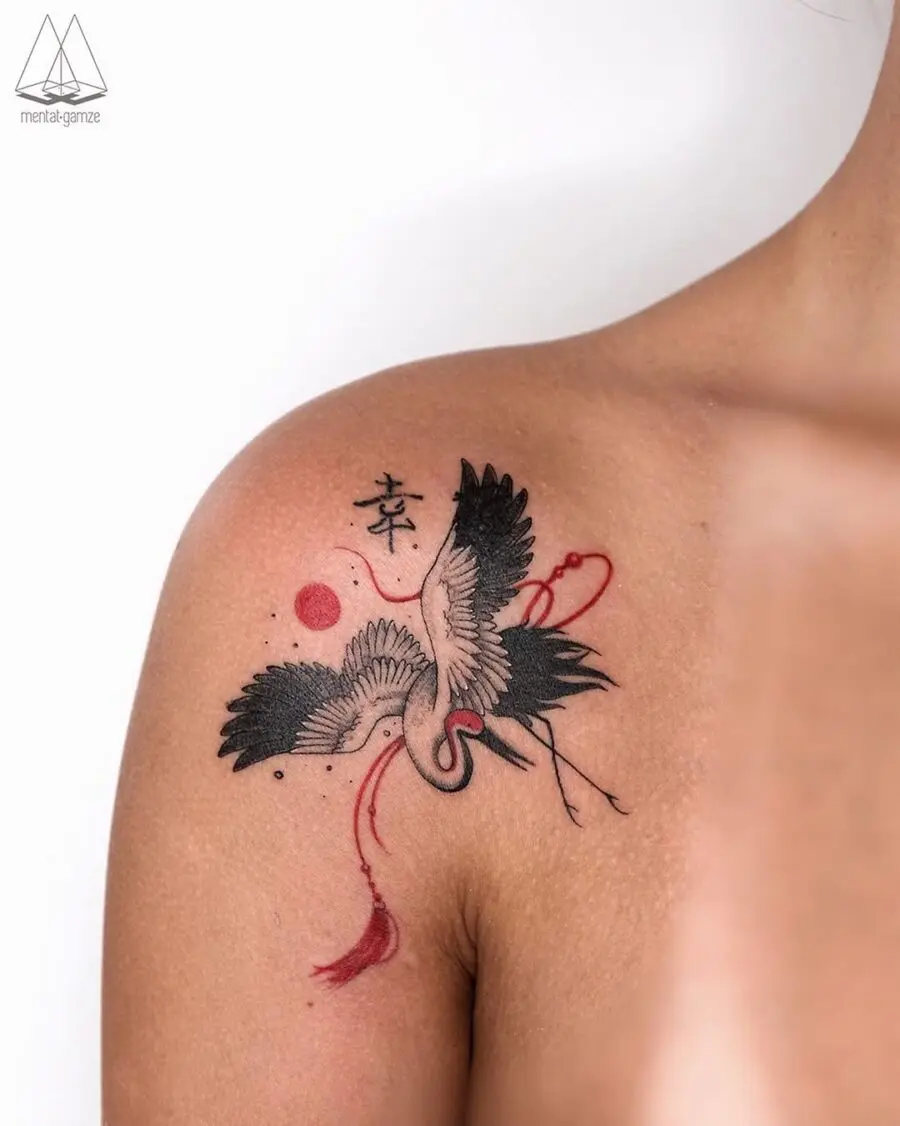 Elegant crane tattoo symbolizes peace and harmony.