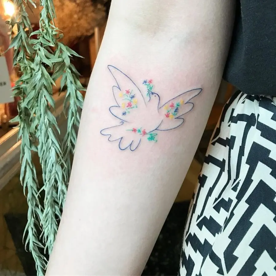 Delicate dove surrounded by colorful flowers