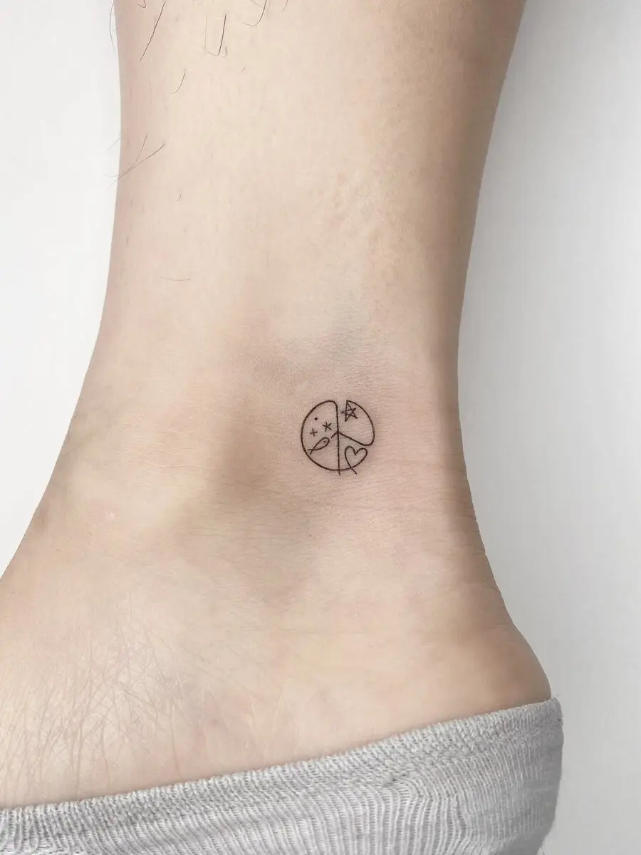Charming minimalist peace symbol tattoo design