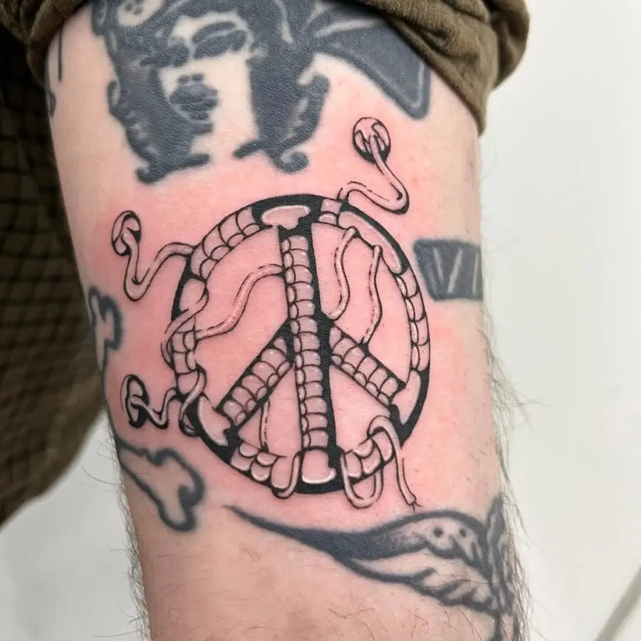 Unique peace symbol intertwined with serpents