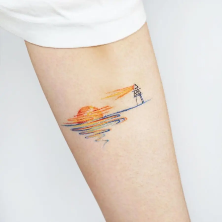 Serene sunset with lighthouse tattoo inspiration