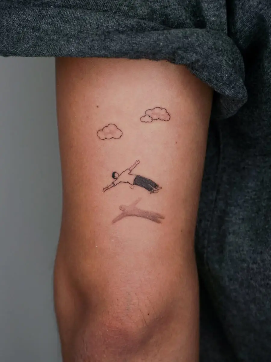 Minimalist swim tattoo for tranquility seekers