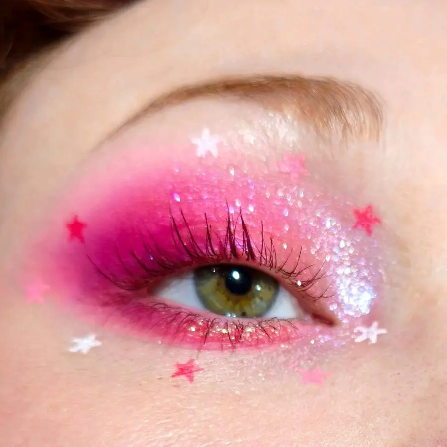 Vibrant pink eyeshadow with sparkling star accents