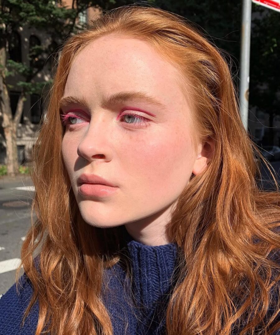 Bold pink eyeshadow enhances natural beauty effortlessly