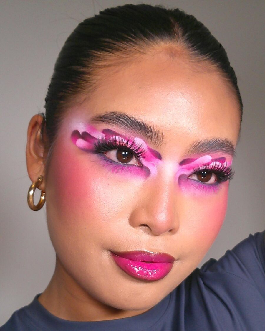 Bold pink eyeshadow with playful designs