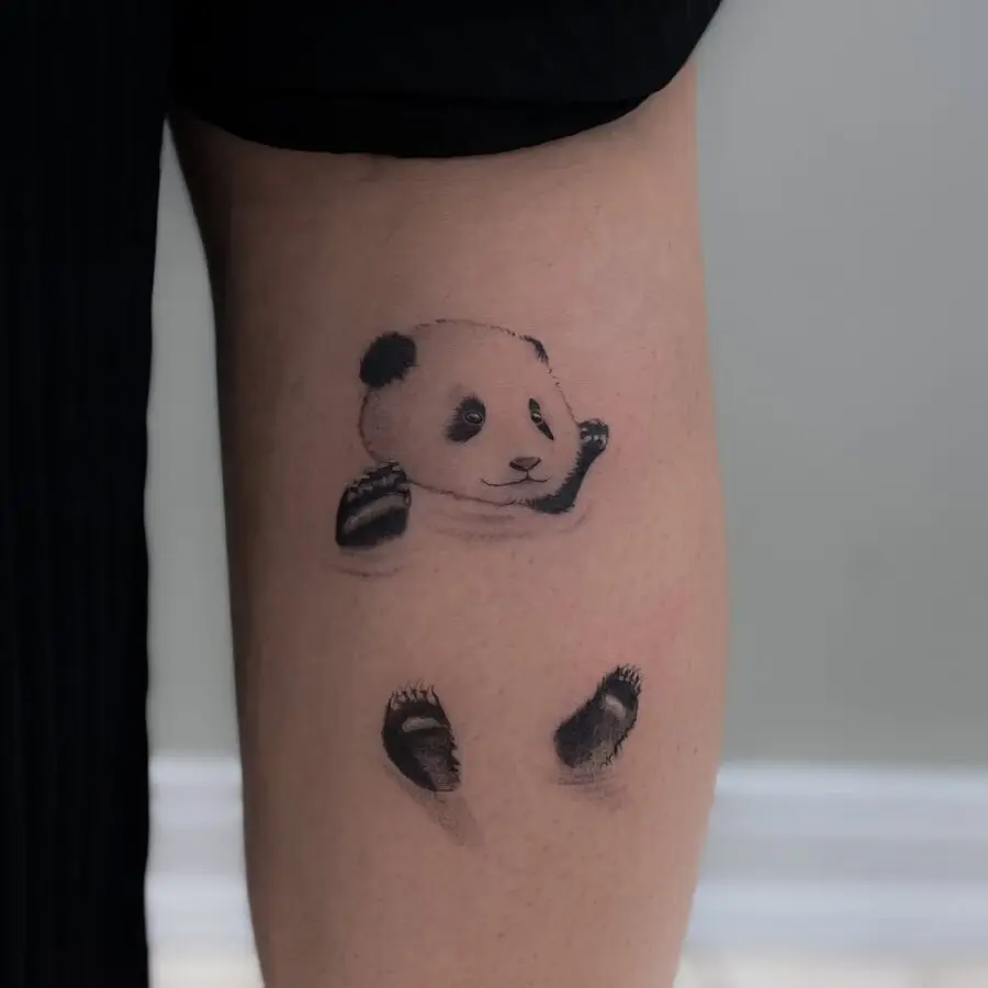 Unique playful panda tattoo design on arm