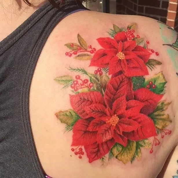 Vibrant Poinsettia Tattoo with Greenery