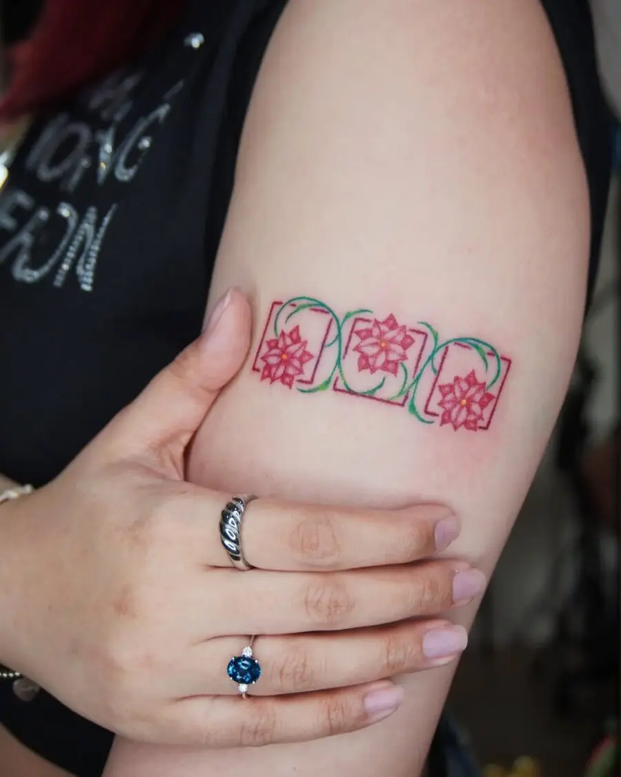 Charming Poinsettia Tattoo on the Arm
