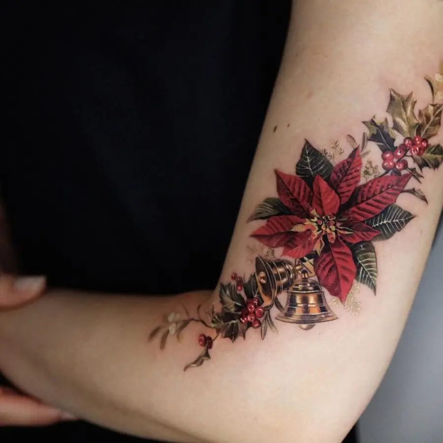 Vibrant poinsettia tattoo with bell detail