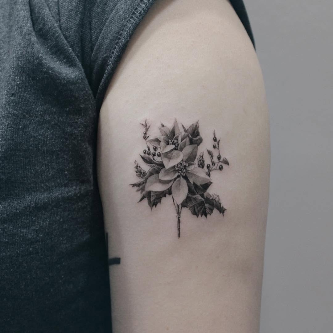 Elegant black and gray poinsettia tattoo design