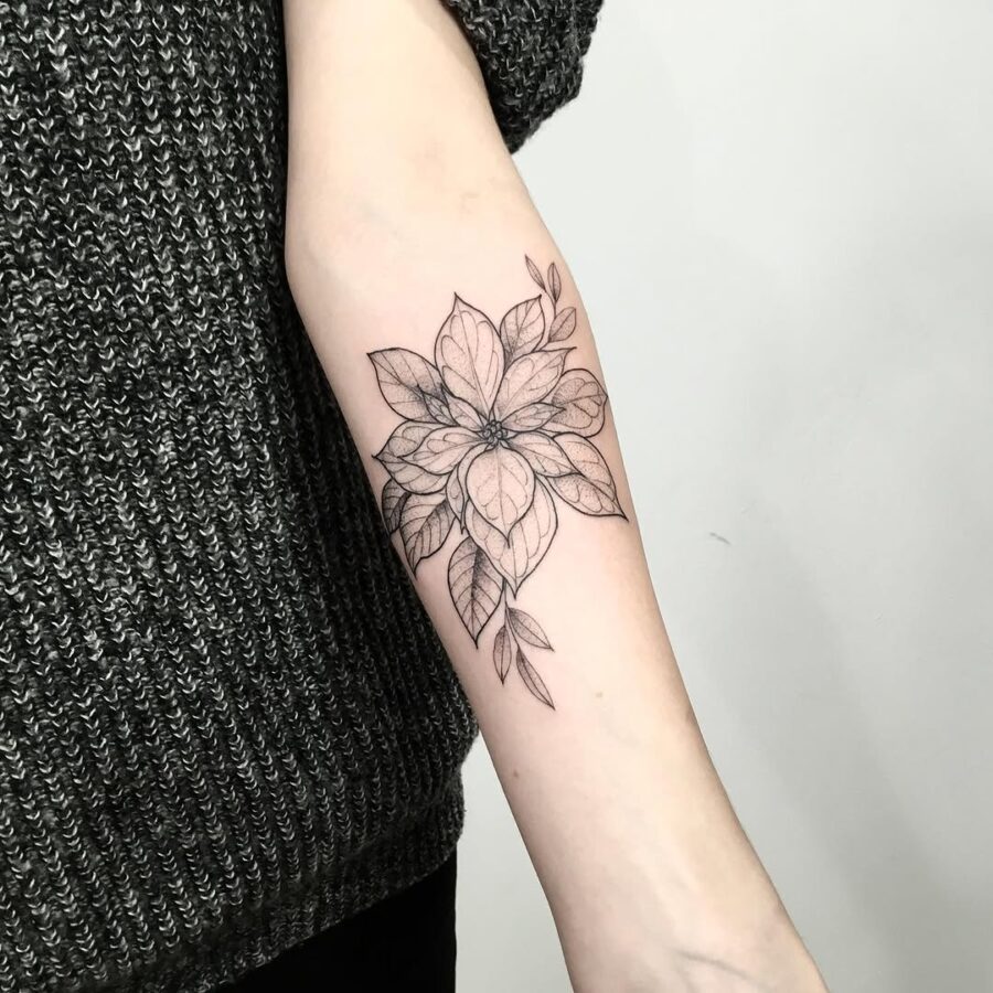 Elegant black line poinsettia arm tattoo design