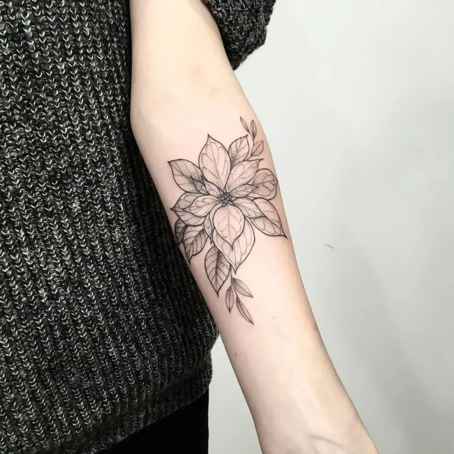 Elegant black line poinsettia arm tattoo design