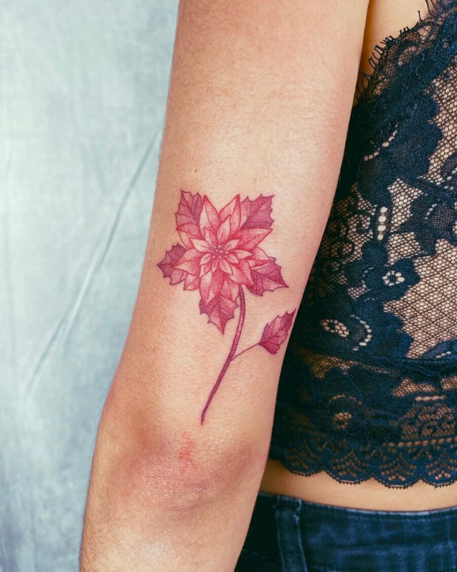 Elegant Poinsettia Tattoo with Bold Colors