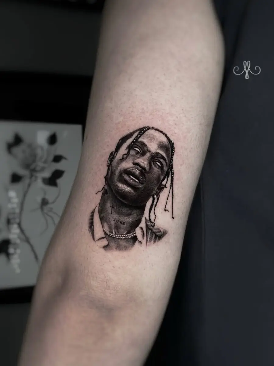 Stunning portrait tattoo capturing musical essence.