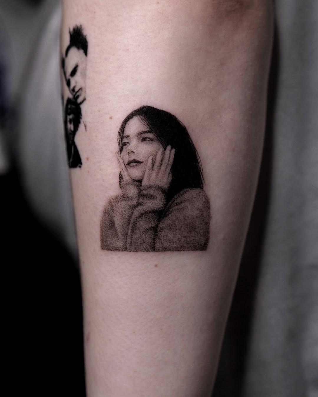 Striking portrait tattoo of a thoughtful female
