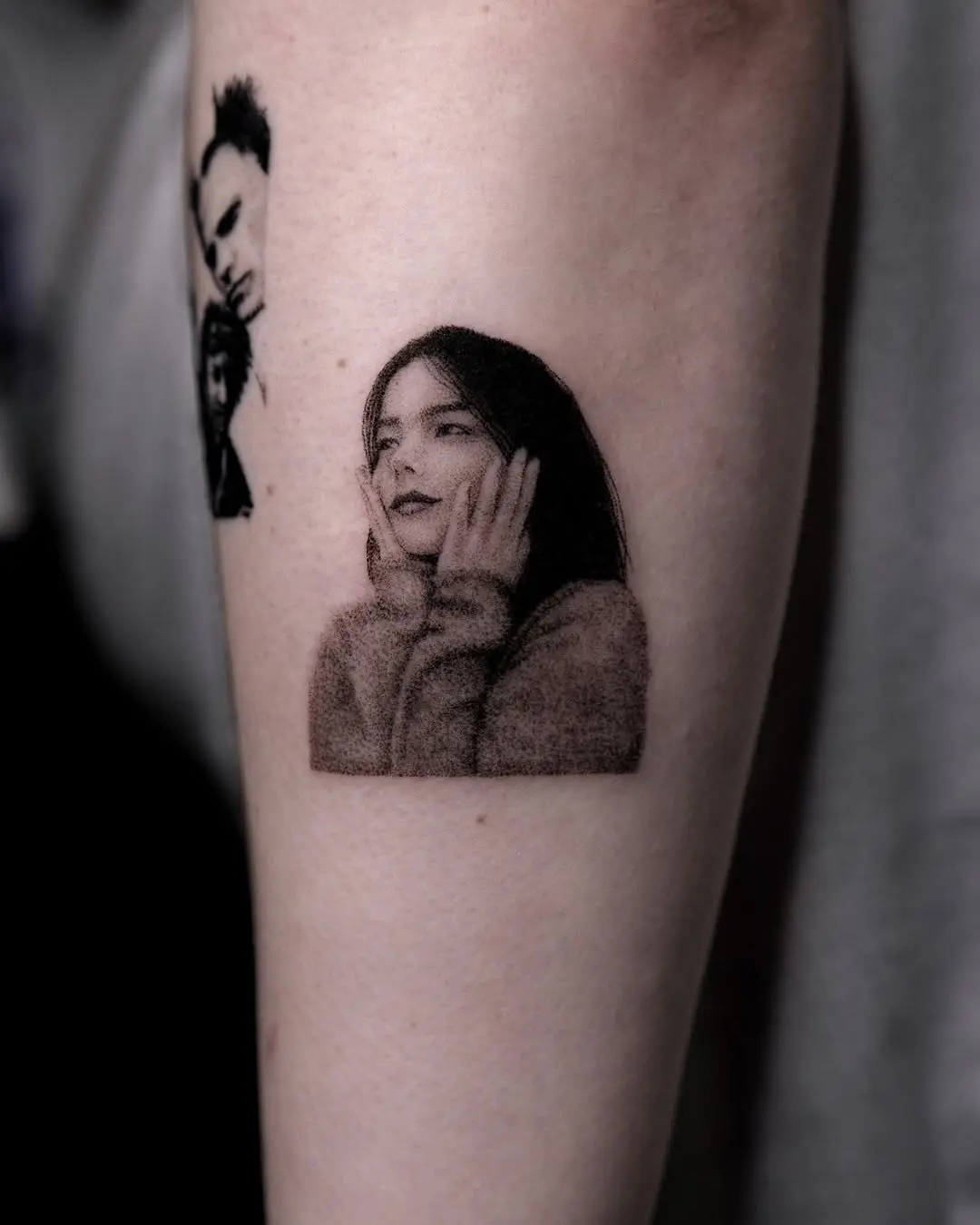 Striking portrait tattoo of a thoughtful female