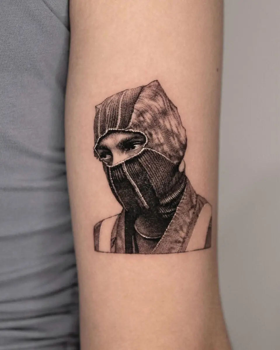 Stunning ninja portrait tattoo with realistic details