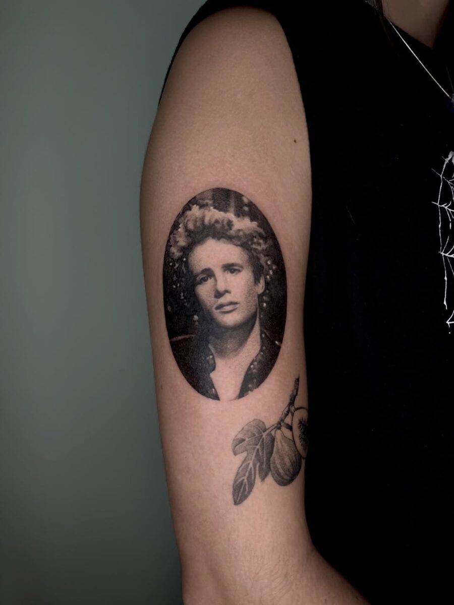 Timeless portrait tattoo with a nostalgic vibe