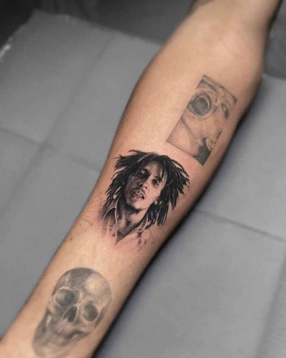 Striking portrait tattoos on forearm showcase artistry
