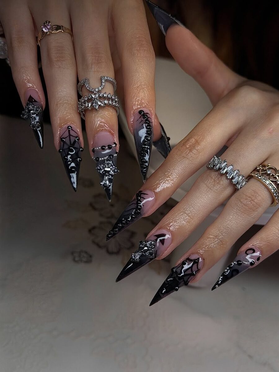 Striking black stiletto nails with glam