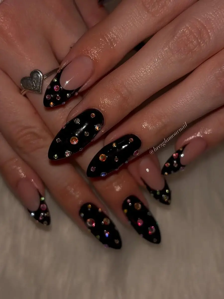 Elegant black nails with colorful rhinestone accents