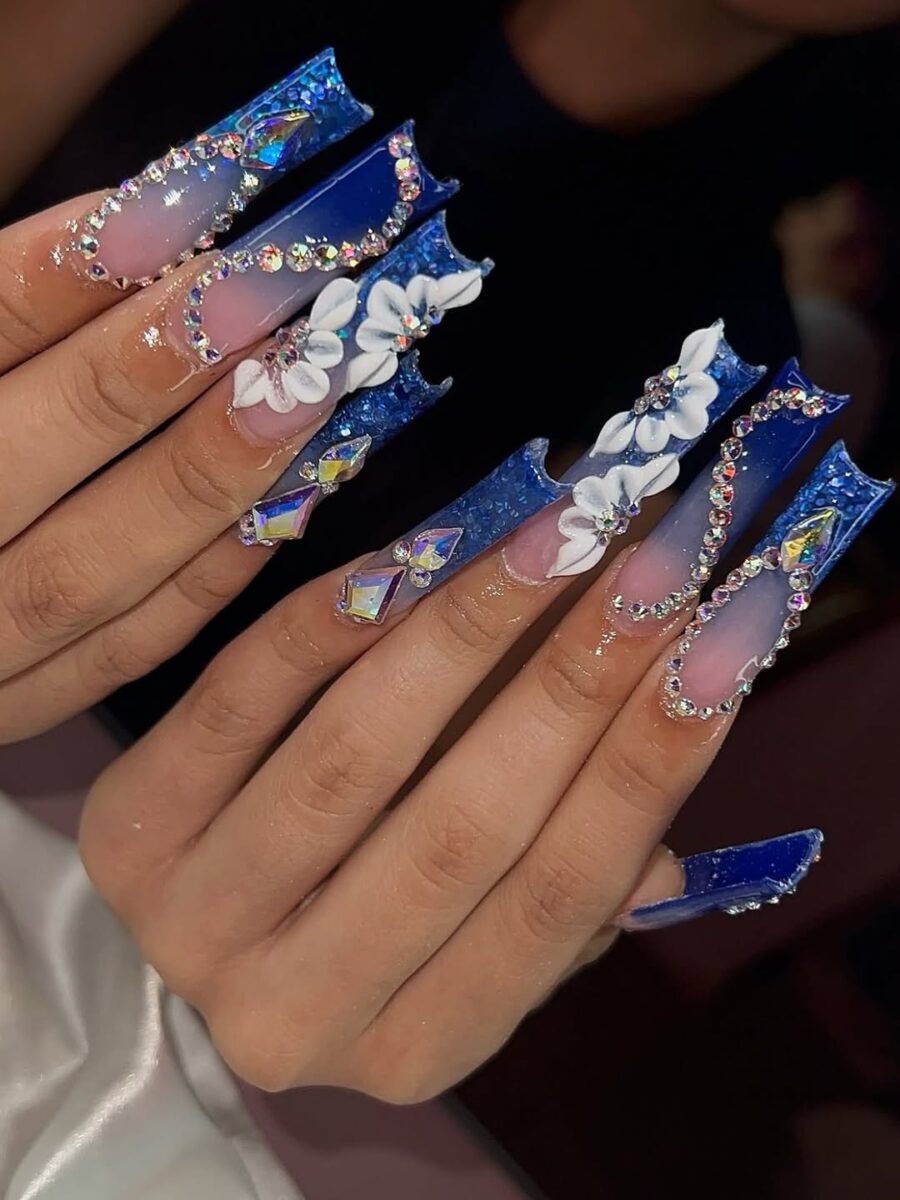 Stunning blue floral prom nails with rhinestones