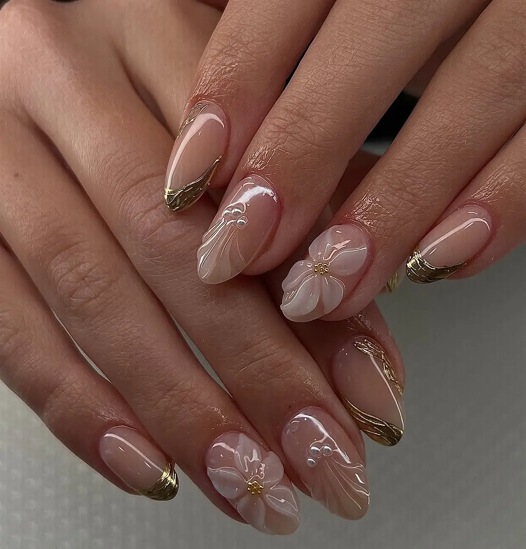 Elegant floral gold-tipped prom nail design