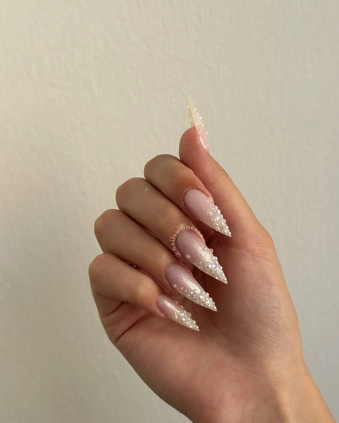 Elegant stiletto nails with pearl accents