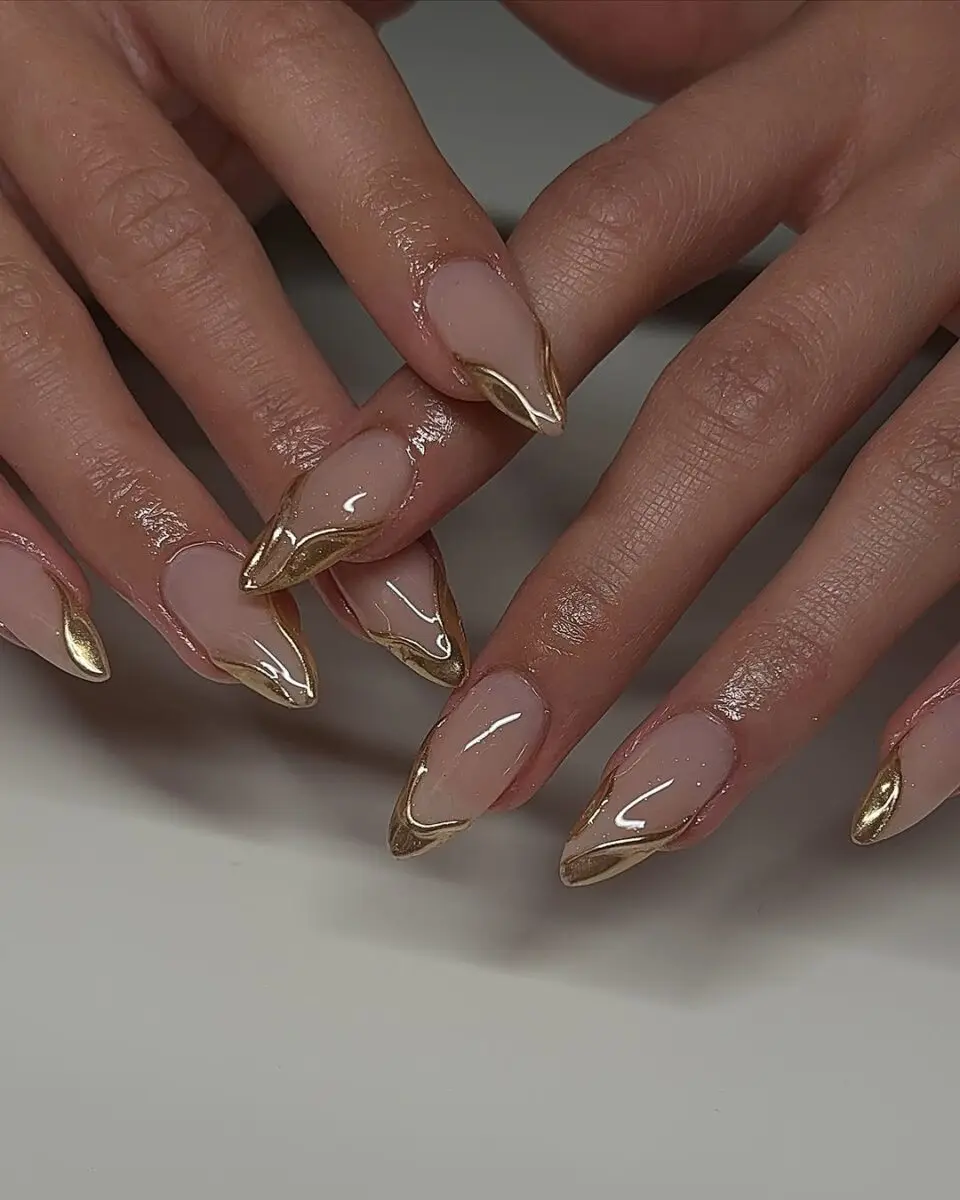 Elegant gold-tipped stiletto nails for prom