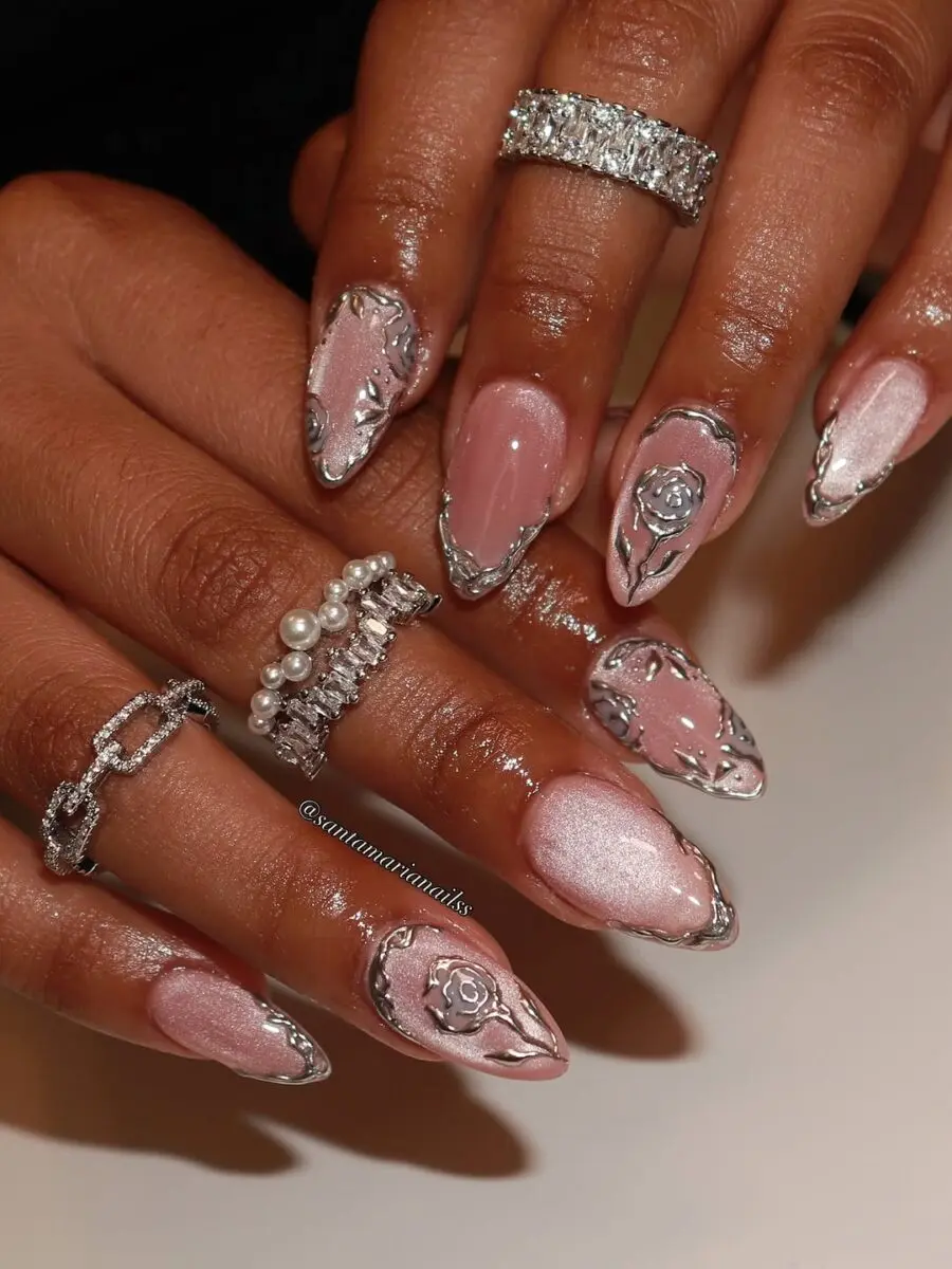 Elegant pink nails adorned with silver accents