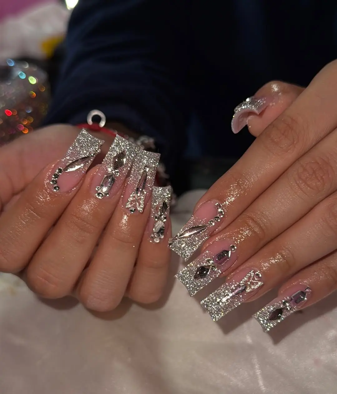 Glamorous sparkly nails with intricate designs