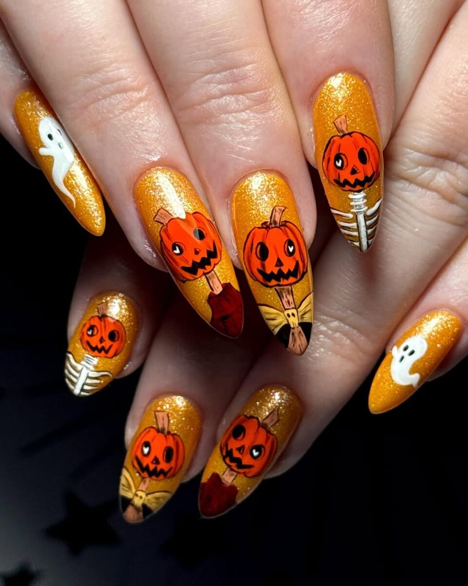 Spooky pumpkins shine on glittery golden nails