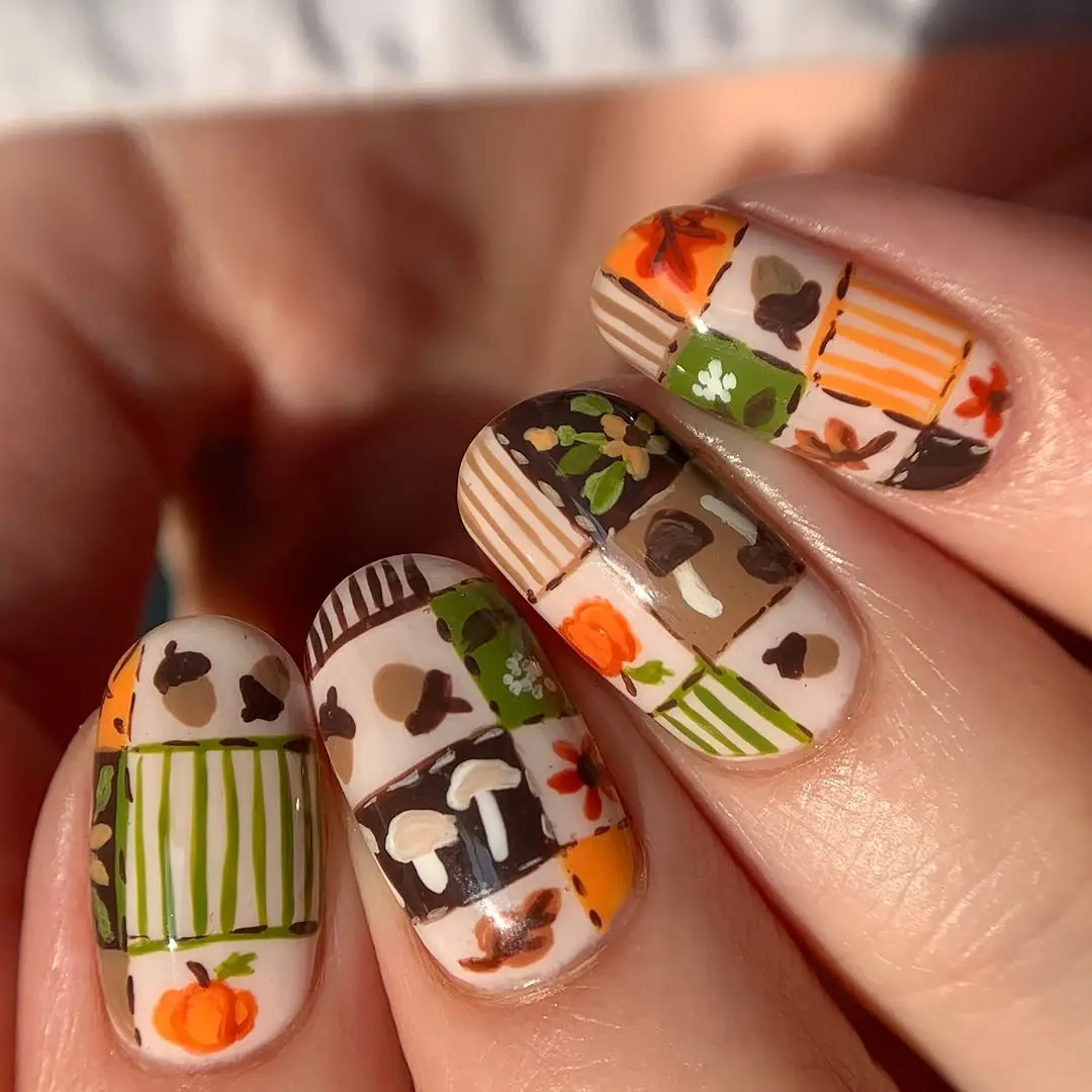 Charming hand-painted pumpkin nail art