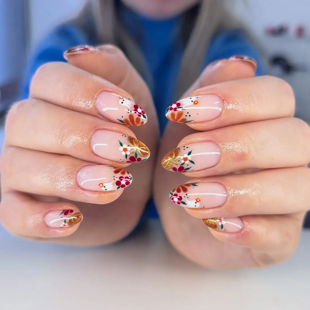 Charming autumn-inspired pumpkin nail art design
