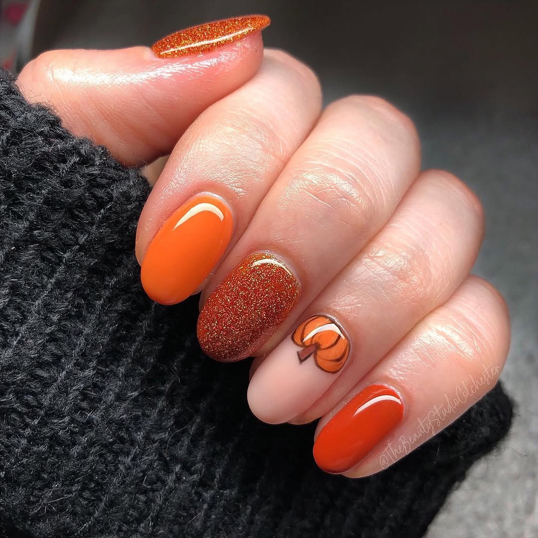 Festive pumpkin-themed nail art for fall