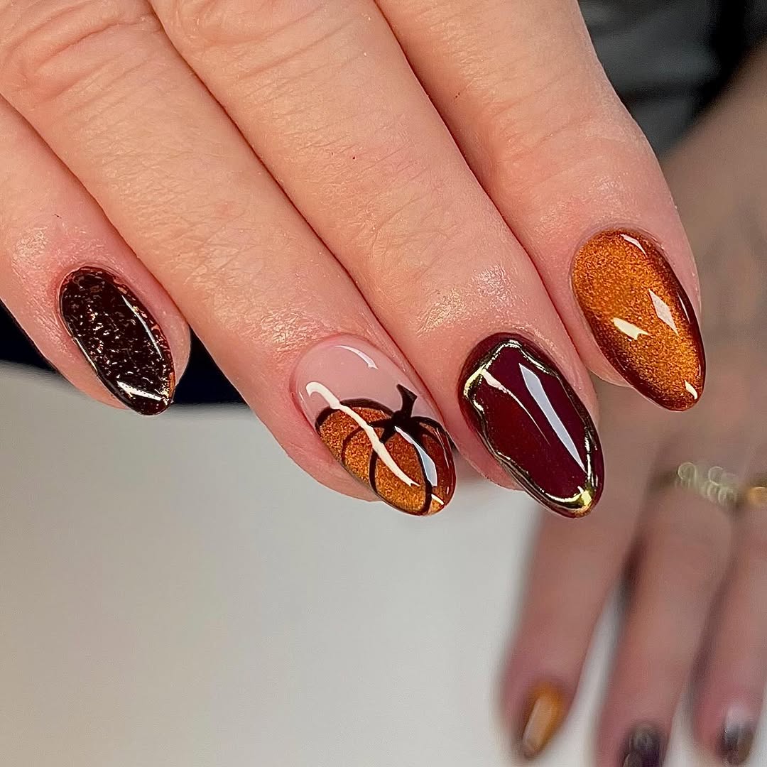 Charming autumn-inspired pumpkin nail art design