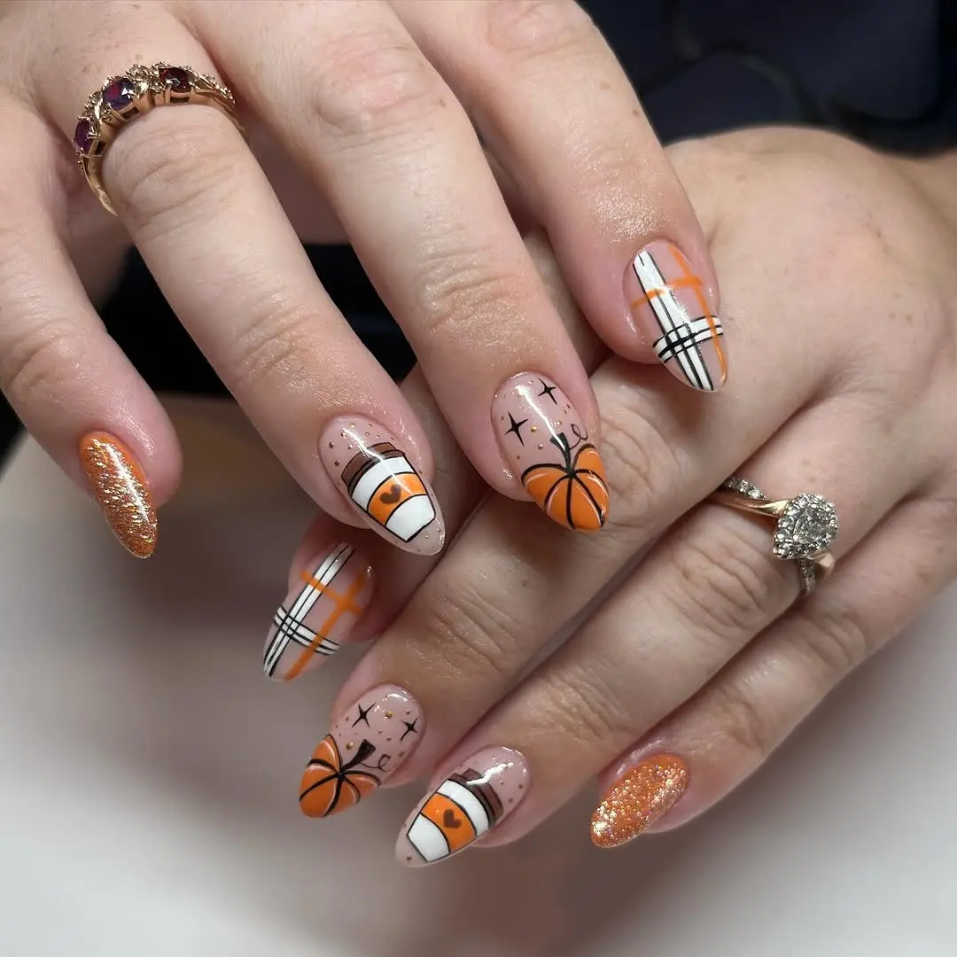 Fun pumpkin-themed nails for the fall season