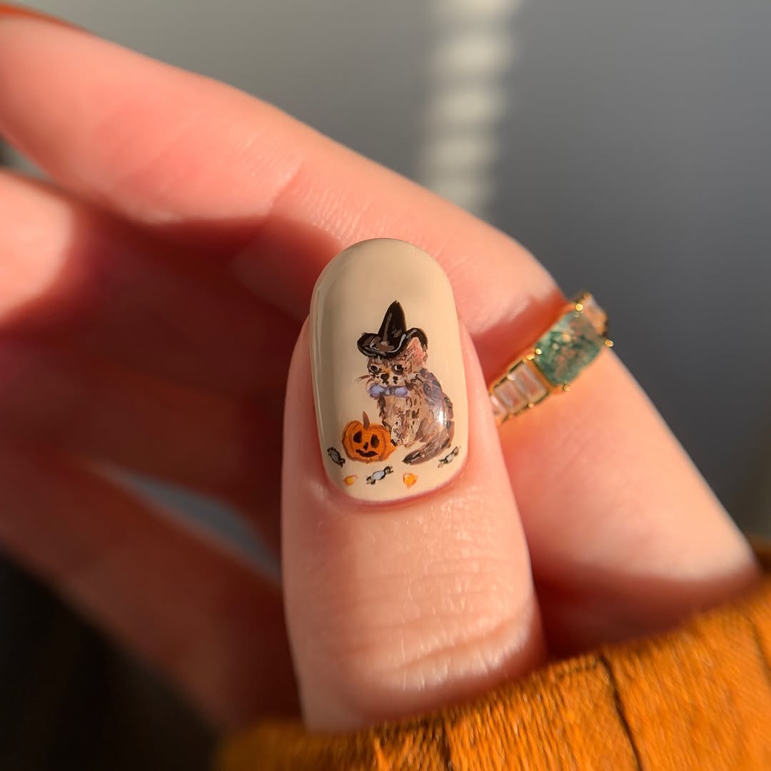 Charming Halloween-themed pumpkin nail art design