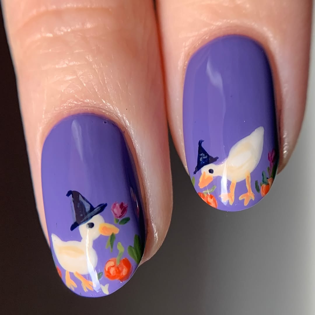 Charming pumpkin-themed witch nails