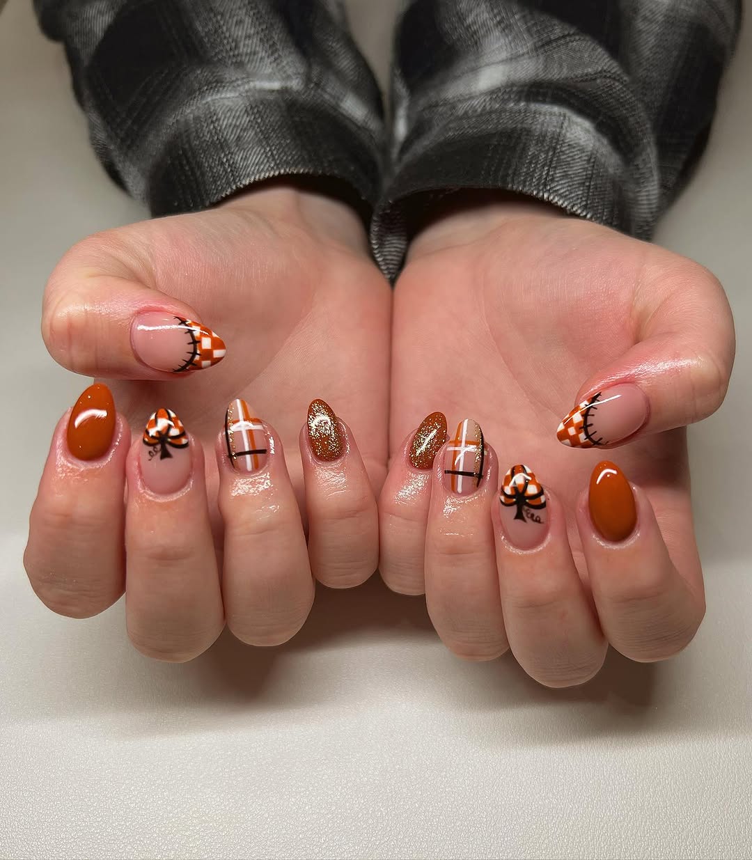 Creative pumpkin-themed nail design for fall.