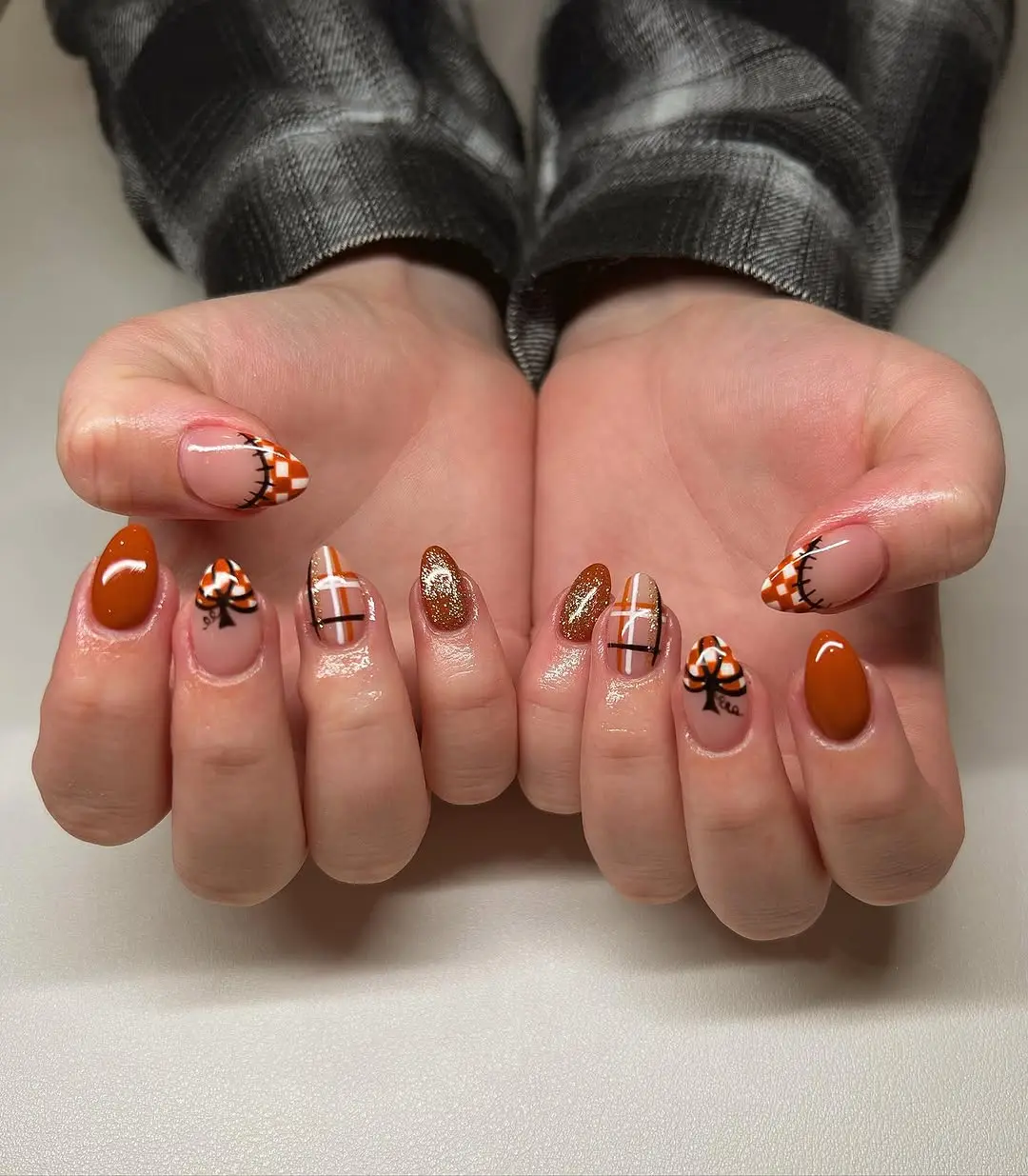 Creative pumpkin-themed nail design for fall.