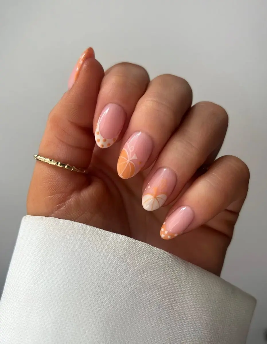 Stylish pumpkin-inspired nails for autumn vibes